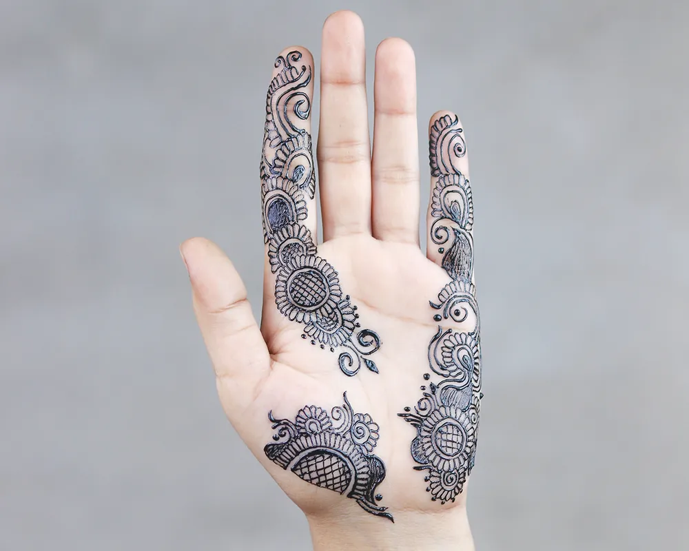 Jagua body art design on a hand
