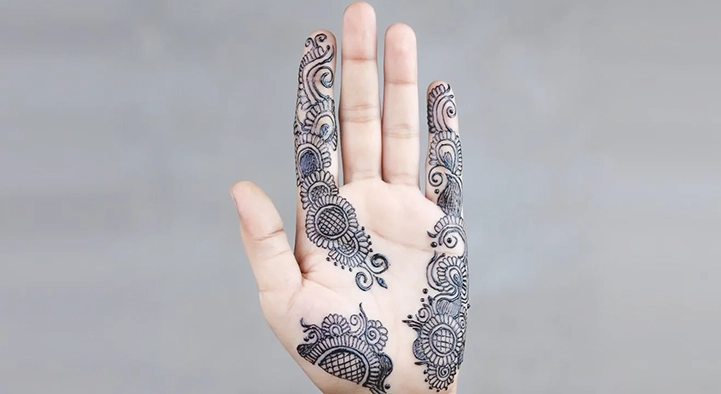 Hand decorated with a jagua body art design